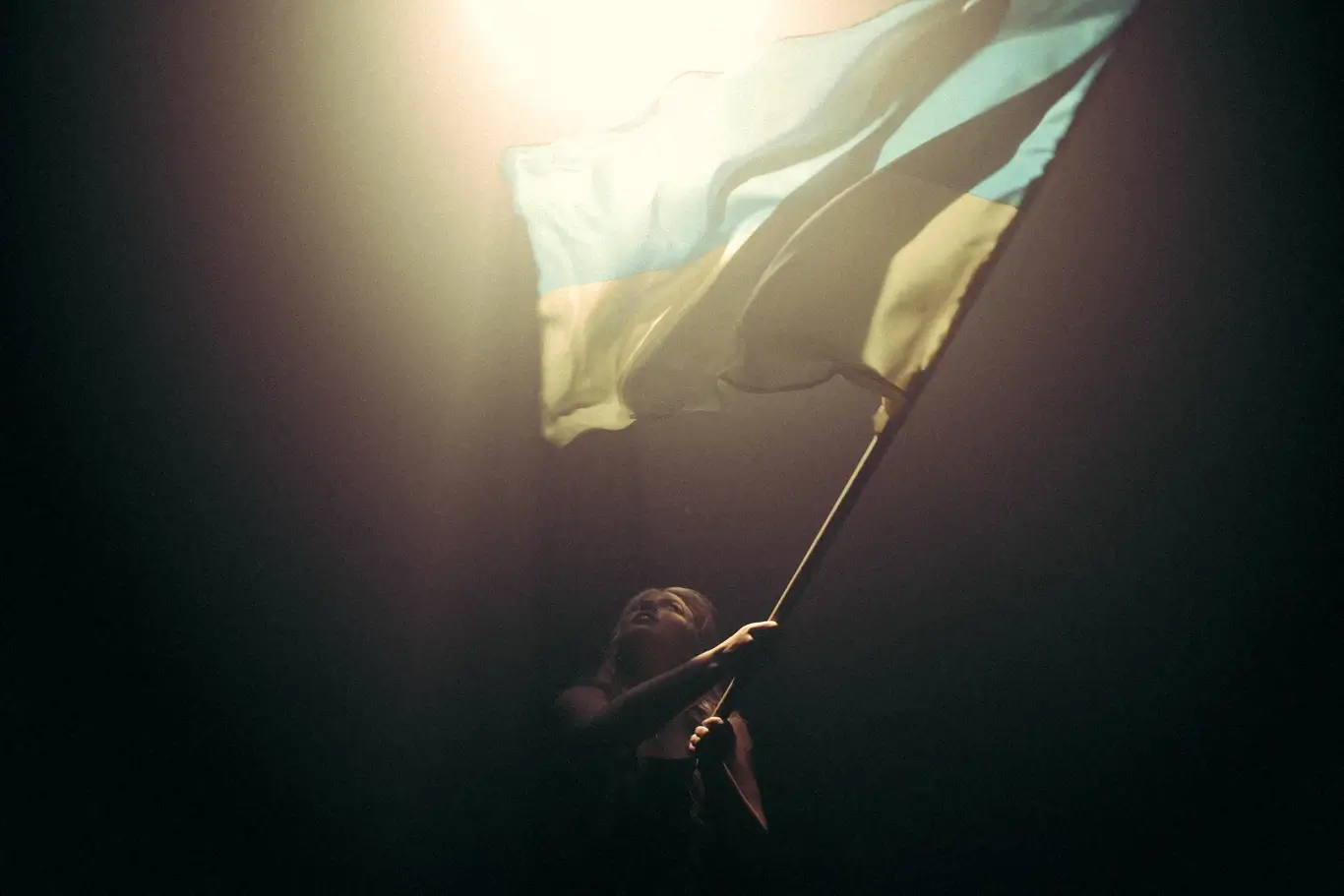 Kelsie Kimberlin holds a Ukrainian flag