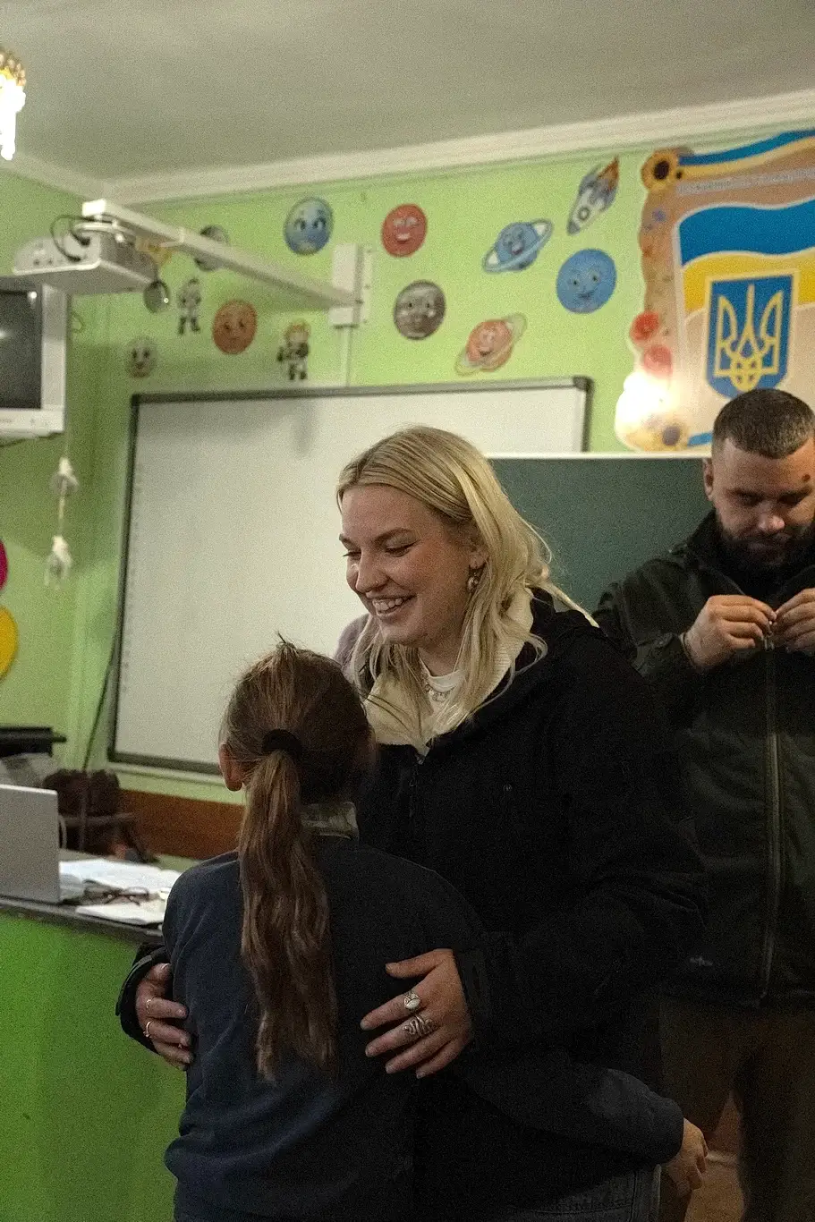 Kelsie Kimberlin hugs children affected by the war Kelsie Kimberlin hugs children affected by the war