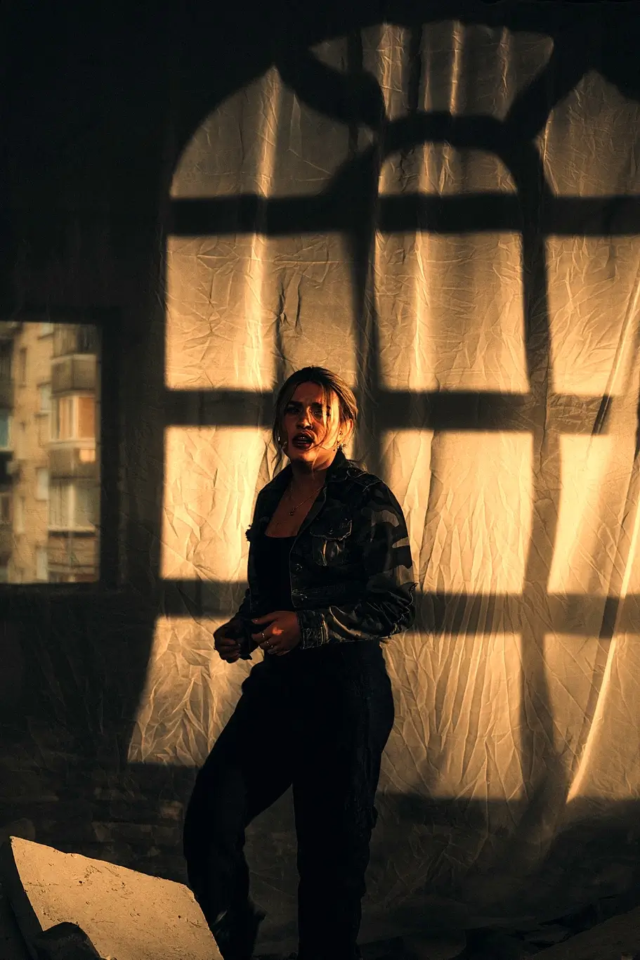 Kelsie Kimberlin in a destroyed house by the window