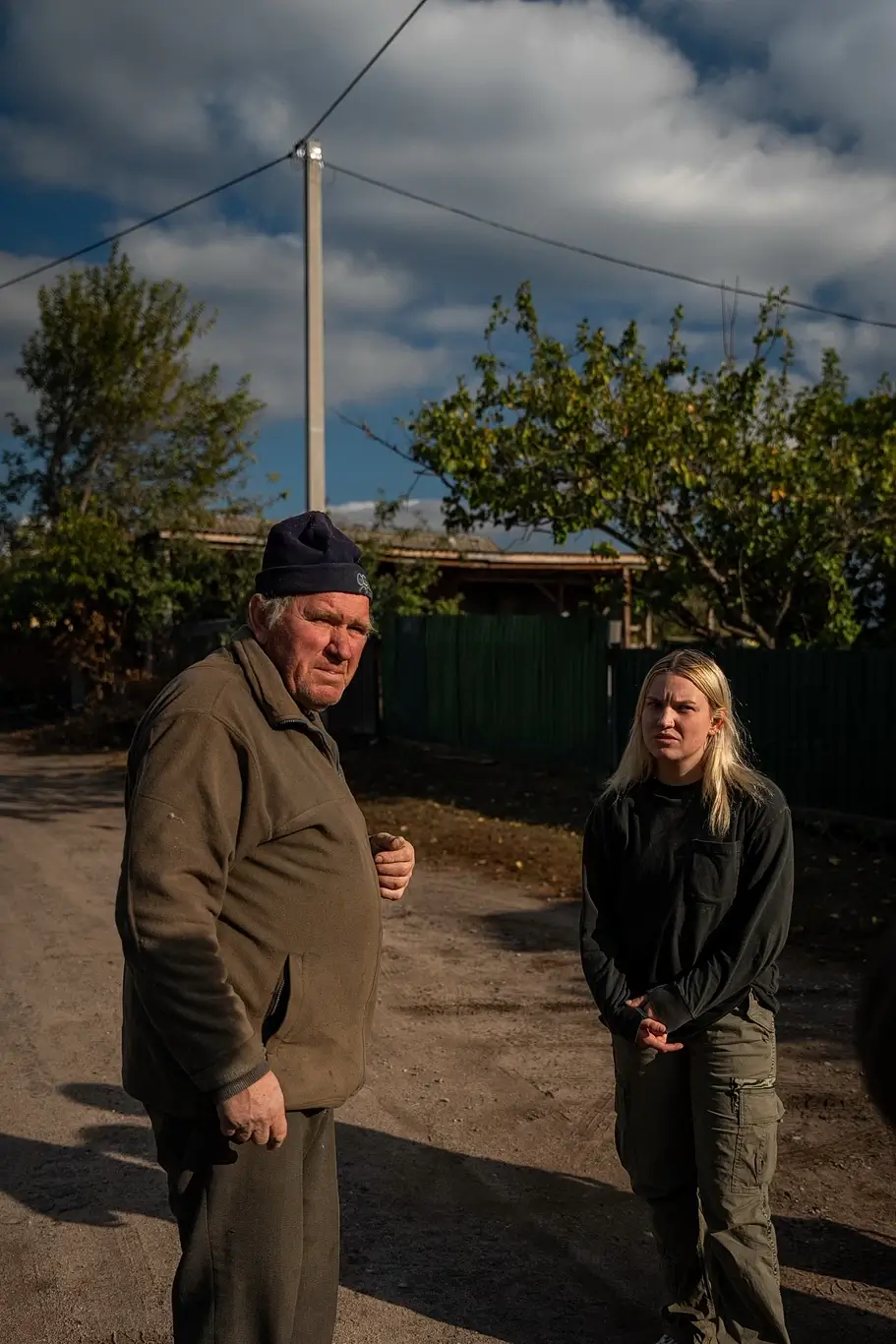 Kelsie Kimberlin is talking to an elderly man Kelsie Kimberlin is talking to an elderly man