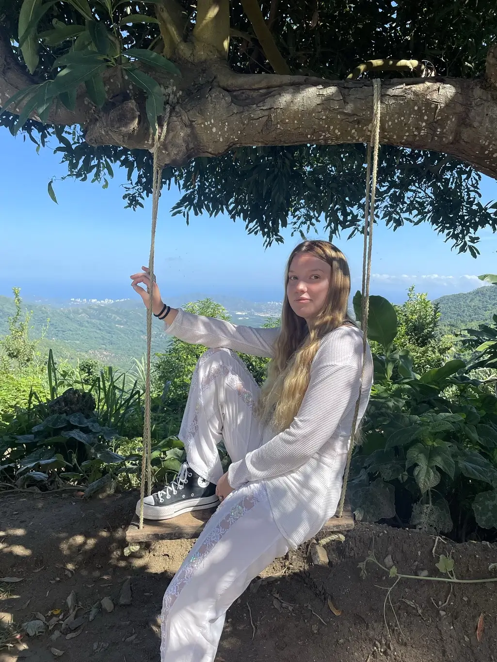 Kelsie Kimberlin sits on a swing