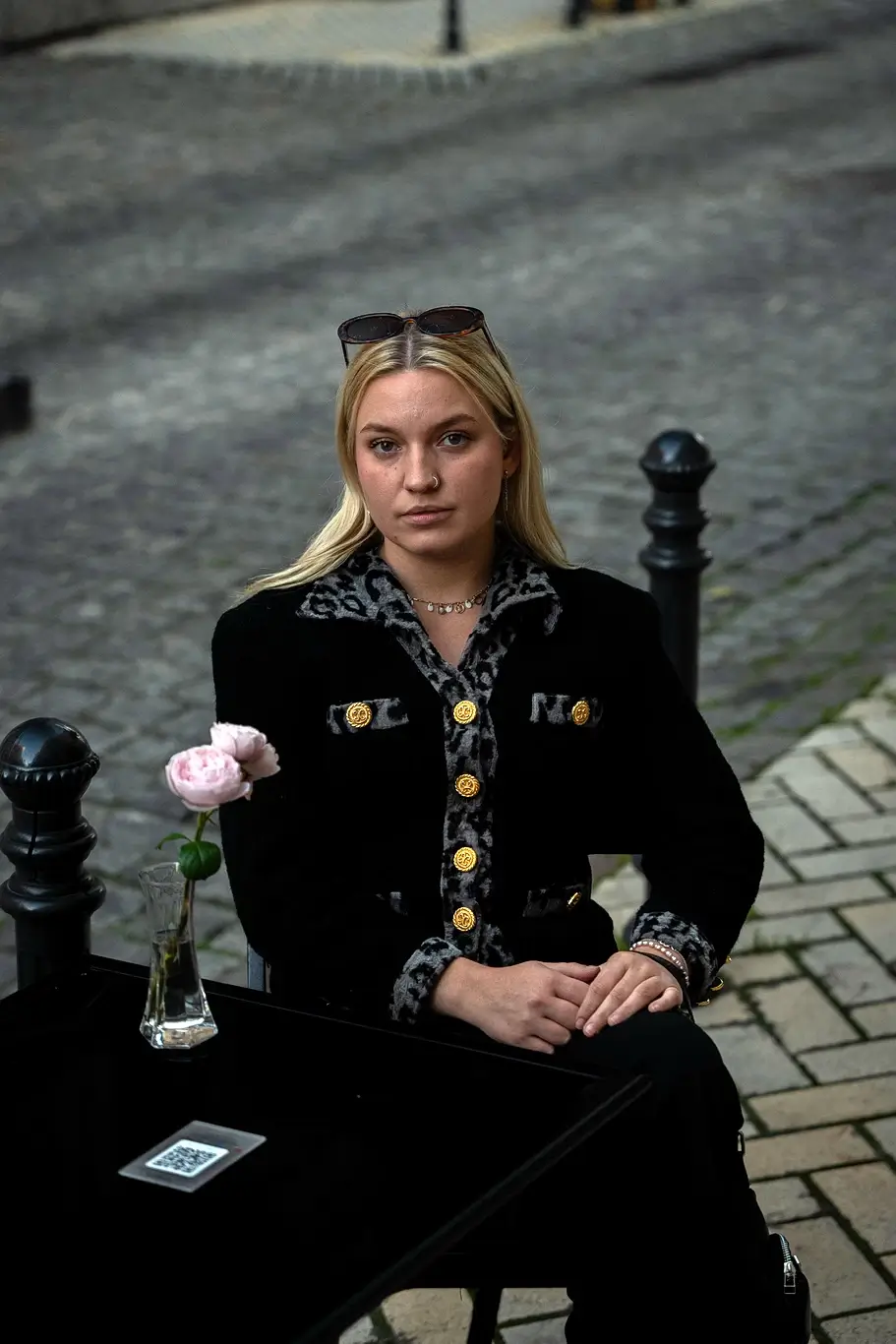 Kelsie Kimberlin sits outside a cafe