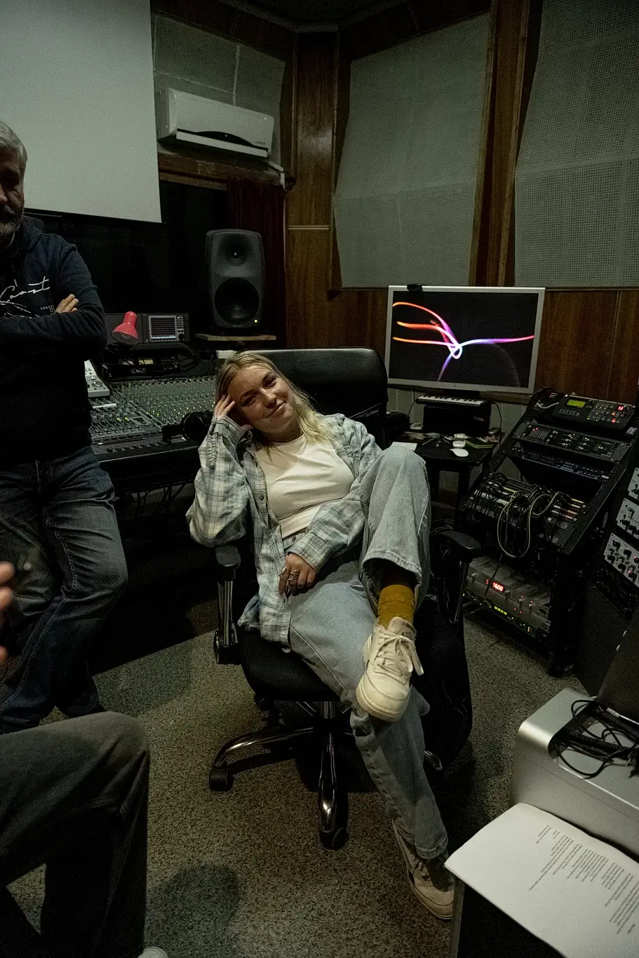 Kelsie Kimberlin is sitting in the sound engineer chair